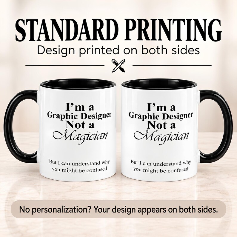 Two views of the same black accent mug showing the “I’m A Graphic Designer, Not A Magician” design printed on both sides.
