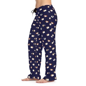 May include: Navy blue pajama pants with a pattern of guinea pigs.