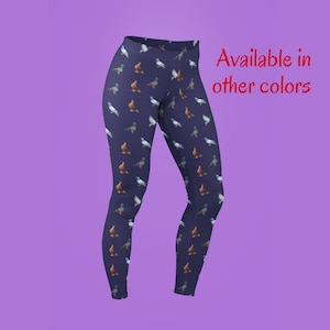May include: Navy blue leggings with a repeating pattern of pigeons. The text "Available in other colors" is in red text at the top right of the image.