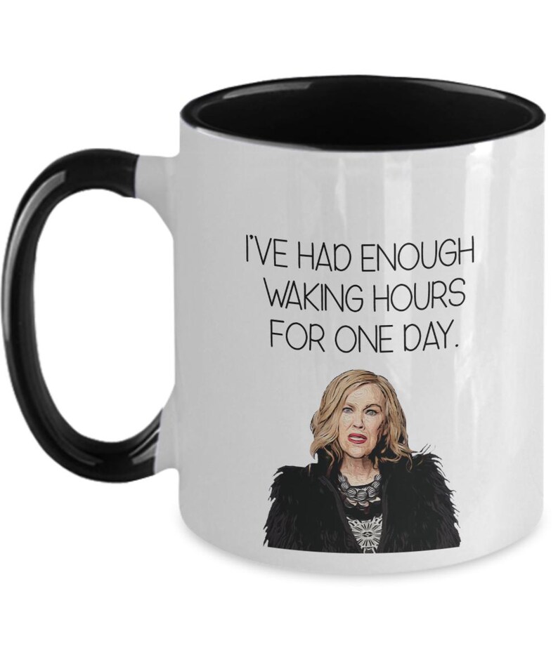 May include: White ceramic mug with a black interior and handle. The mug features the text "I'VE HAD ENOUGH WAKING HOURS FOR ONE DAY." and an illustration of a woman.