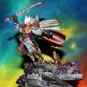 May include: A miniature figure of a warrior with a golden helmet, purple armor, and a white cape. The figure is holding a sword and is standing on a base with a purple and gray rock formation. The figure is surrounded by scrolls with text that reads "The Emperor Protects".