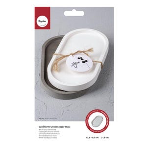 Könnte beinhalten: Eine weiße Silikonform zum Herstellen von ovalen Untersetzern. Die Form ist 17,8 cm x 9,5 cm groß und 1,16 cm tief. Die Form wird mit einem grauen Betonuntersetzer gezeigt, der mit der Form hergestellt wurde.