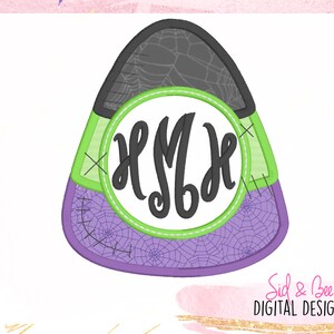 May include: A purple, green and grey candy corn shaped embroidery design with a white circle in the centre. The circle has a black monogram "HSMH" inside.