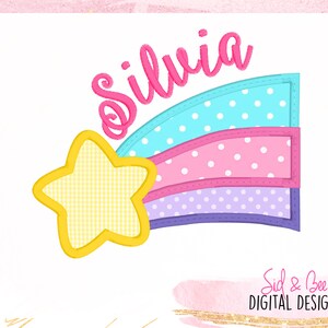May include: A colorful rainbow with white polka dots and a yellow star. The rainbow is in shades of blue, pink, and purple. The word "Silvia" is written in pink cursive above the rainbow.