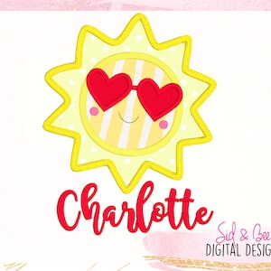 May include: A yellow sun with a smiling face wearing red heart-shaped sunglasses. The name Charlotte is written in red below the sun. The text "Sid & Bee DIGITAL DESIGNS" is in the bottom right corner.