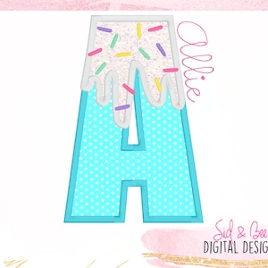May include: A blue letter A with white frosting and colorful sprinkles. The frosting is dripping down the sides of the letter. The name "Allie" is written in pink cursive to the right of the letter.