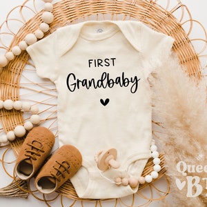 First Grandbaby Onesie® - Pregnancy Announcement - Baby Reveal Infant Bodysuit - First Grandchild Coming Soon - Surprise Baby.