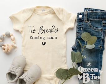 Tie Breaker Coming Soon Onesie® - Third Baby Pregnancy Announcement