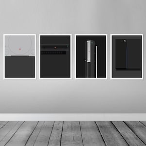 May include: Four framed prints of different PlayStation consoles, each with a black background and the PlayStation logo. The consoles are arranged in a row from left to right: PlayStation 1, PlayStation 2, PlayStation 3, and PlayStation 4.