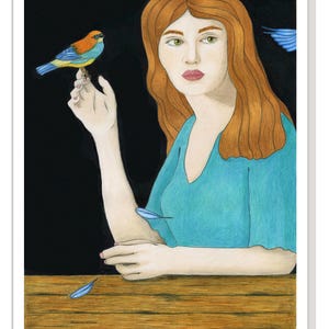 May include: A woman with long, red hair sits at a table with a small blue bird perched on her finger. The background is black, and there are blue feathers scattered on the table.