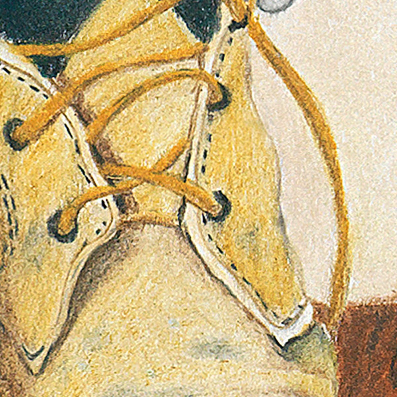 May include: Close-up of a beige leather boot with yellow laces tied in a knot. The laces are worn and frayed, and the boot has a stitched seam around the edge.