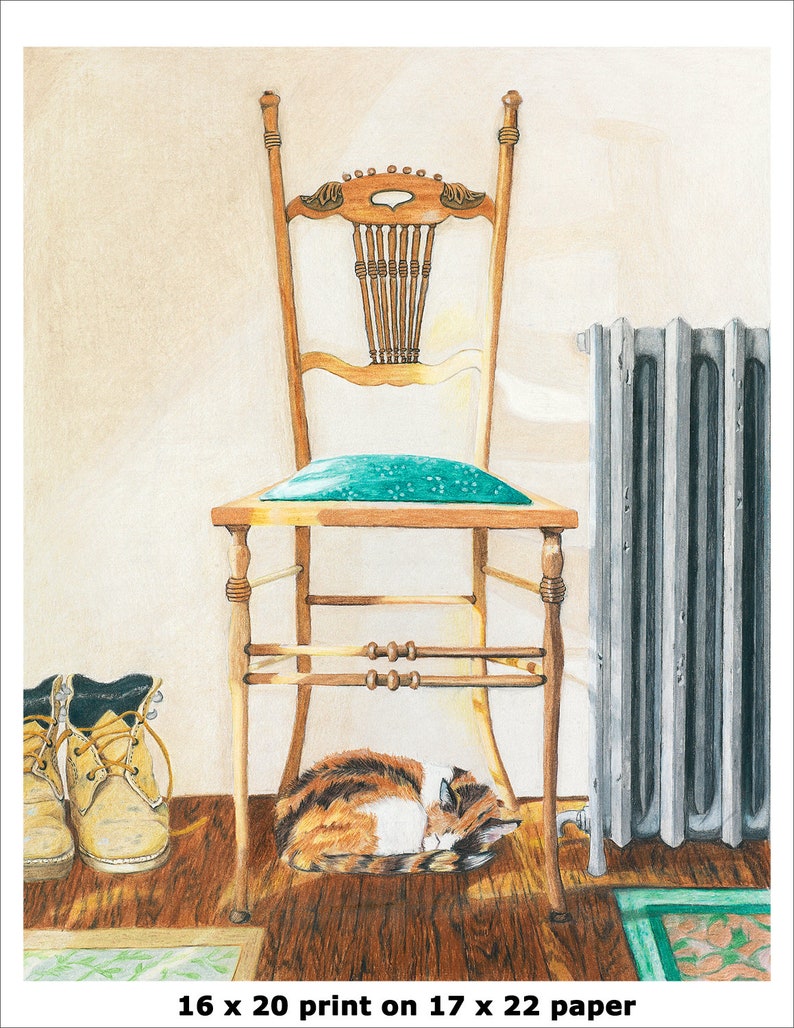 May include: A calico cat sleeps under a wooden chair with a teal cushion. The chair has a carved back and is in front of a white wall. Two brown work boots are on the floor to the left of the chair. The image is captioned "16 x 20 print on 17 x 22 paper".