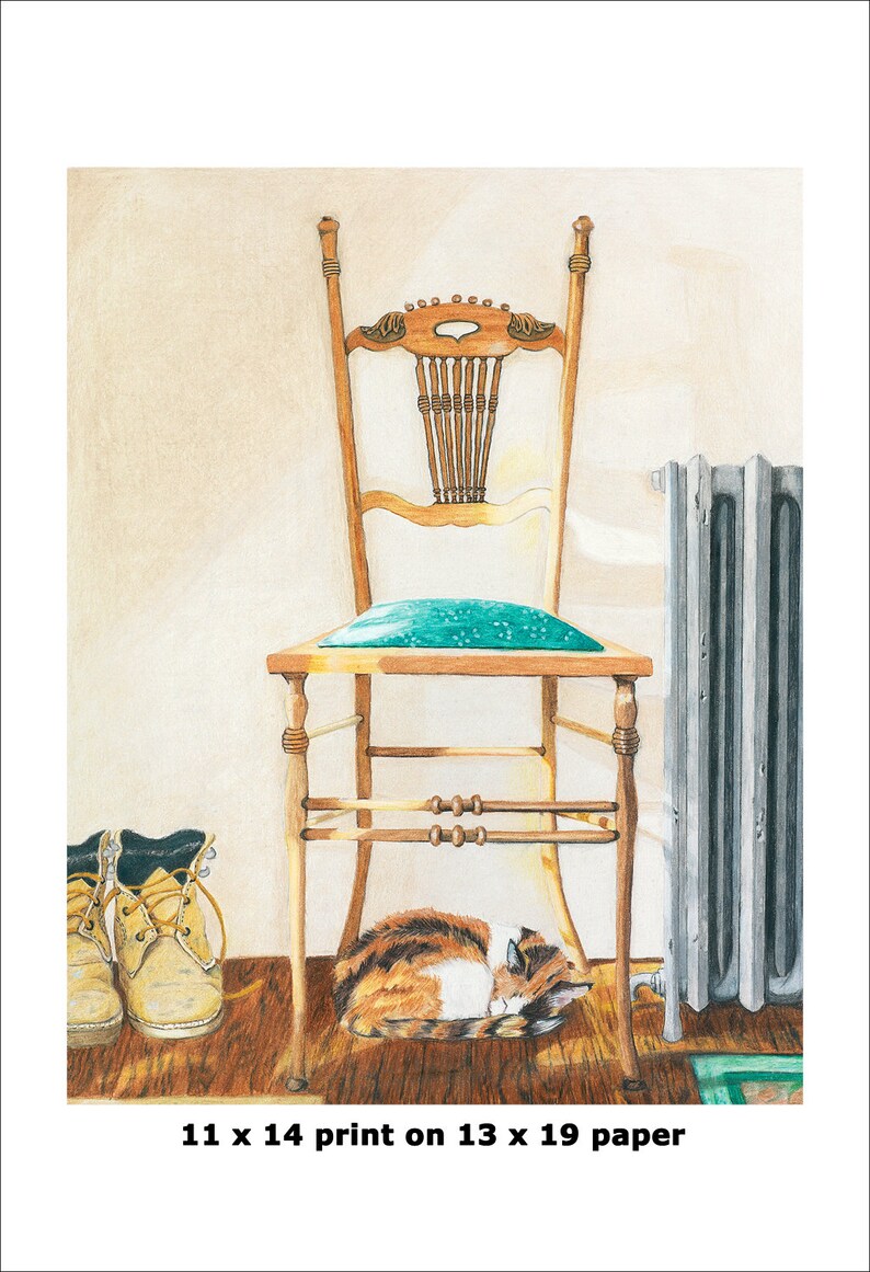 May include: A brown and white cat sleeps under a wooden chair with a teal cushion. The chair is in front of a silver radiator. There are two brown work boots on the floor to the left of the chair. The image is captioned "11 x 14 print on 13 x 19 paper".