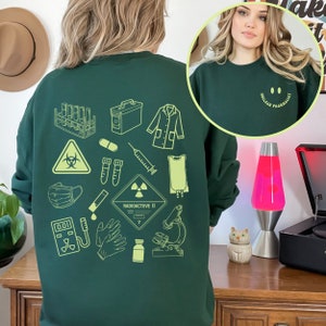 Felpa con scritta "PharmD" per farmacista nucleare, regalo per farmacista nucleare, regalo di laurea in farmacia, felpa girocollo con scritta "Radioactive Rx", maglione per la settimana della farmacia