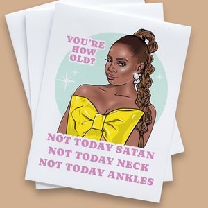May include: A greeting card with a cartoon illustration of a woman with a yellow top and a braided ponytail. The text on the card reads "You're how old? Not today Satan, Not today neck, Not today ankles."