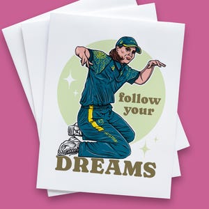 May include: A green and yellow sports uniform with a yellow star on the sleeve. The person wearing the uniform is kneeling with their arm raised. The text "follow your DREAMS" is printed below the person.