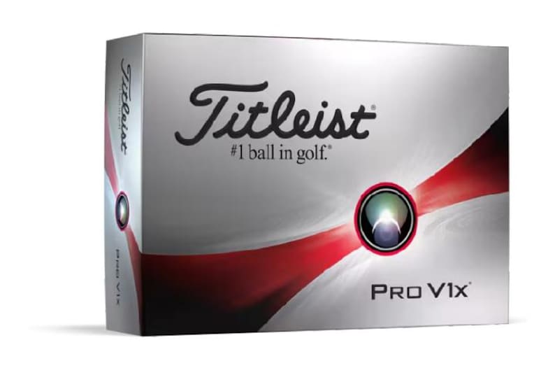 May include: A silver and red golf ball box with the Titleist logo and the text "#1 ball in golf." The box also features a red and white swirl design and the text "Pro V1x."