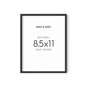 May include: Black wood frame with the text "HAUS & HUES", "NATURAL", "8.5x11", and "OAK FRAME" printed in white.