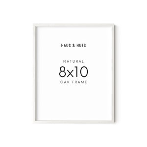 May include: White 8x10 inch natural oak frame with the text "HAUS & HUES" and "NATURAL 8x10 OAK FRAME" printed on the front.