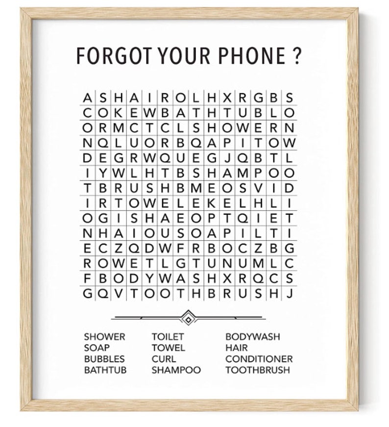 May include: A black and white word search puzzle with the words "Forgot your phone?" at the top. The puzzle includes words related to bathroom items, such as shower, soap, towel, shampoo, and toothbrush.