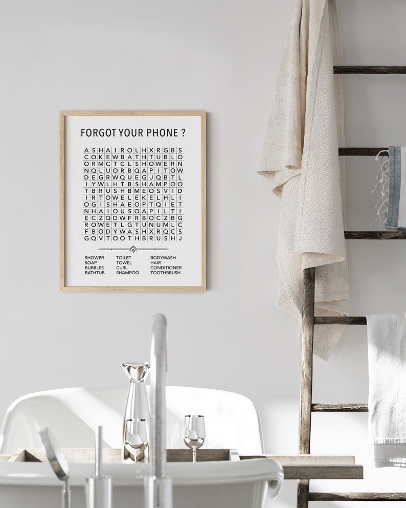 May include: A black and white printable bathroom wall art poster with the text "Forgot your phone?" and a word search puzzle with the words "shower, soap, bubbles, bathtub, toilet, towel, curl, shampoo, bodywash, hair, conditioner, toothbrush".