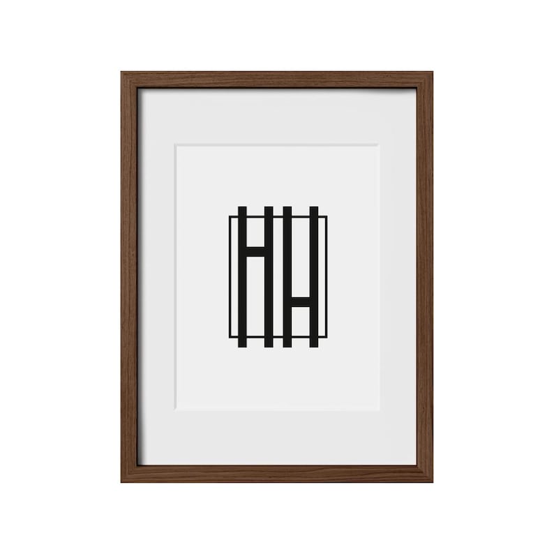 May include: A framed print with a black and white geometric design of the letters "HH" inside a square.