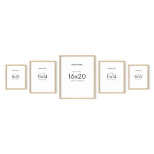 May include: Five natural oak picture frames in different sizes. The frames are arranged in a row from left to right, with the largest frame in the center. The frames are labeled with their dimensions: 8x10, 11x14, 16x20, 11x14, and 8x10.