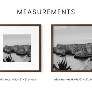 May include: Two brown wood picture frames with black and white photos of a rocky cliffside and ocean. The frame on the left has a white mat and holds an 8x8 inch photo. The frame on the right has no mat and holds a 12x12 inch photo.