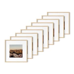 May include: A collection of eight square picture frames with light wood-colored frames and white mats. The frames are arranged in a diagonal line, each displaying a landscape image. The bottom-left frame has the text "12x12".