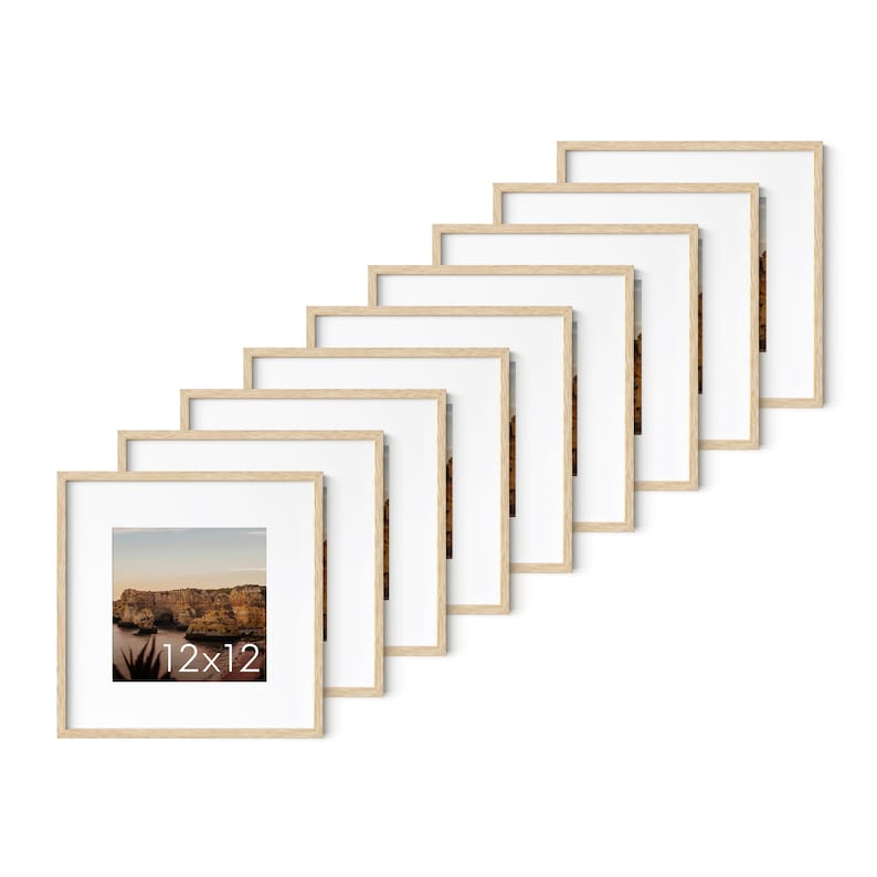 May include: A collection of eight square picture frames with light wood-colored frames and white mats. The frames are arranged in a diagonal line, each displaying a landscape image. The bottom-left frame has the text "12x12".