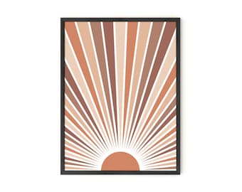 May include: A framed print with a geometric sunburst design in shades of brown, orange, and white. The sunburst is centered on a solid orange circle.