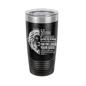 May include: Black stainless steel tumbler with a lion graphic and the text "Be Strong & Courageous Do Not Be Afraid Do Not Be Discouraged For The Lord Your God Will Be With You Wherever You Go Joshua 1:9"