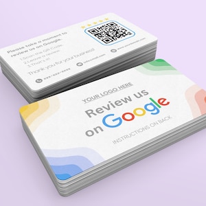 May include: A stack of business cards with a colorful abstract design and the text "Review us on Google" with instructions on the back. The back of the card has a QR code and instructions on how to leave a review.