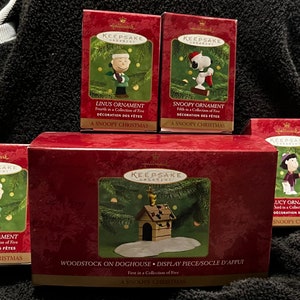 Peanuts 50th Anniversary Vintage Hallmark Christmas Ornament Set of 4 and Base New In Boxes Snoopy Charlie Brown Lucy Linus Woodstock