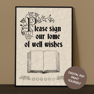 May include: Black framed print with the text "Please sign our tome of well wishes" above an open book illustration. The print has a vintage parchment paper background and decorative floral elements.
