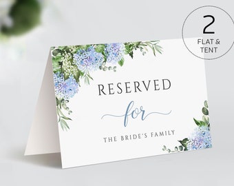 May include: A white card with blue hydrangea floral border and the text "Reserved for The Bride's Family".