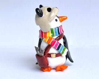 Hand-Painted Penguin Figurine with Panda Hat and Rainbow Scarf – Whimsical Collectible
