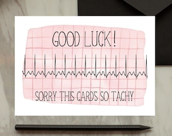 May include: A pink and white card with a black EKG line and the text "GOOD LUCK! SORRY THIS CARD'S SO TACHY".