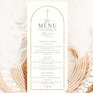 May include: A rectangular menu card with a gold cross and arched frame. The text reads "The Menu" and "Theodore's Baptism" in elegant script. The menu lists appetizers, main courses, and desserts.
