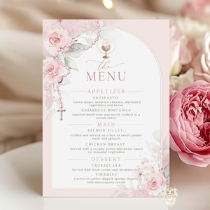 May include: A pink menu card with floral and religious design. The menu includes appetizers, main courses, and desserts. The card is decorated with pink roses and a rosary. The text "The Menu" is at the top.
