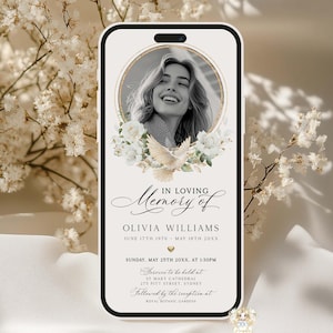 May include: A smartphone screen displays a memorial design. The design features a black and white photo of a woman, surrounded by a gold frame and white flowers. Text reads "In Loving Memory of Olivia Williams" with dates and service details.