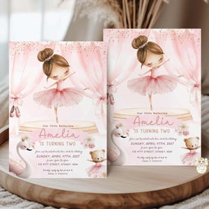 May include: Two pink ballerina birthday invitations. Each invitation features a watercolor illustration of a ballerina, with the text "Amelia is turning two." The invitations include details for the birthday celebration.