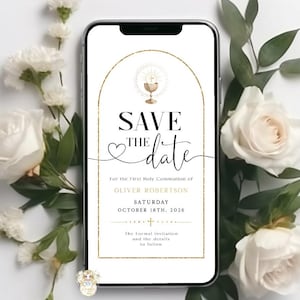 May include: A smartphone displays a "Save the Date" invitation for a First Holy Communion. The invitation features gold accents and elegant script. White roses and greenery surround the phone, creating a soft, floral frame.