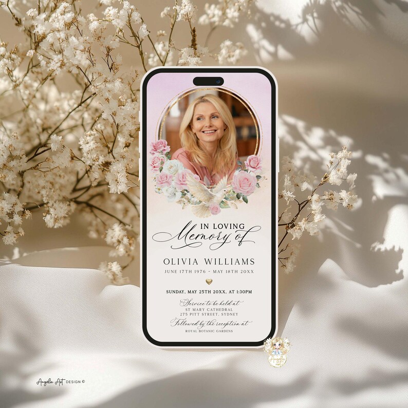 May include: A smartphone screen displays a memorial announcement. The design features a photo of a woman surrounded by flowers and a dove. Text includes "In Loving Memory of Olivia Williams" and service details.