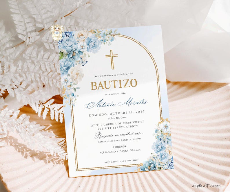 May include: Baptism invitation card with a gold cross and floral accents. The card features the word "BAUTIZO" in gold lettering, along with the name "Antonio Morales" and event details. Blue and white flowers adorn the corners.