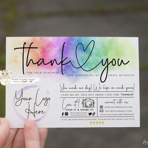 May include: A thank you card with a watercolor rainbow background and a heart. The card says "Thank you for your purchase and supporting my small business!"  It also includes a space for a logo, a discount code, and social media information.