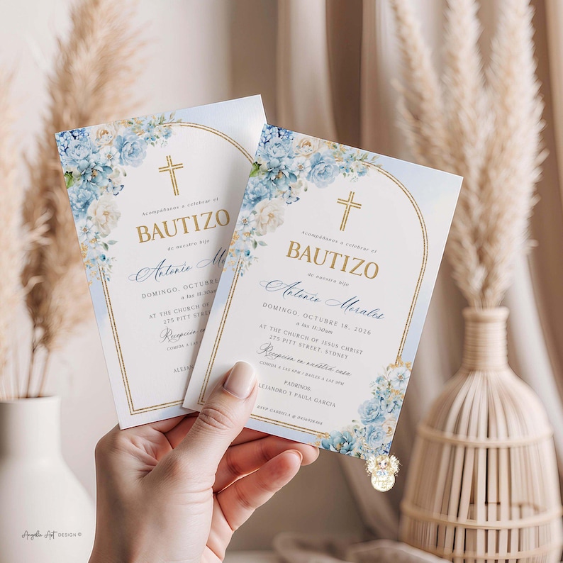 May include: Two baptism invitations with floral and gold accents. The cards feature a cross, the word "BAUTIZO", and event details. The design includes blue and white flowers, with text in gold and blue.