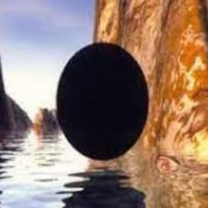 May include: A black circle floating in a body of water between two large, rocky cliffs. The water is a light blue and the cliffs are a mix of brown, orange, and yellow.