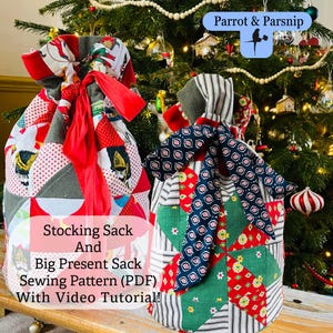 May include: Two patchwork fabric gift sacks with drawstring closures. One is red, white, and gray with a red ribbon. The other is green, red, and blue with a patterned bow. Text on the image reads "Stocking Sack And Big Present Sack Sewing Pattern (PDF) With Video Tutorial!"