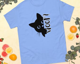 May include: A light blue t-shirt with a black silhouette of a cat peeking out from behind the word "WOOF?" printed on the front.